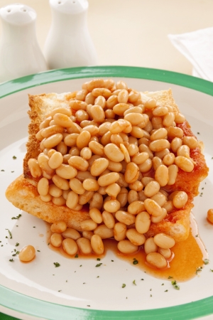 Delicious and simple old fashioned baked beans stack on toast.の写真素材