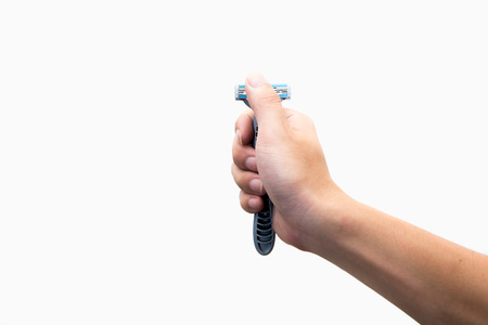 Hand with shaving razor on a white backgroundの写真素材