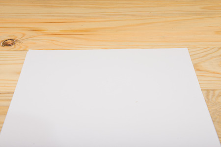 Blank paper on wood tableの写真素材
