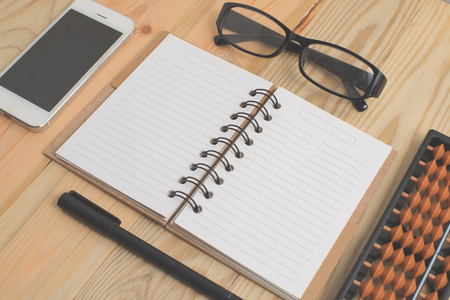 Spiral notebook on wood backgroundの写真素材