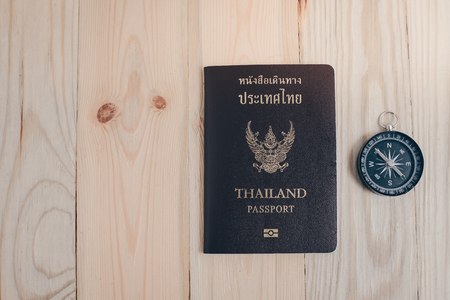 Thailand passport on the wooden tableの写真素材