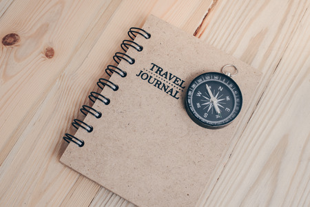 Different objects for traveling on wooden backgroundの写真素材