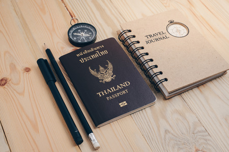 Thailand passport on the wooden tableの写真素材