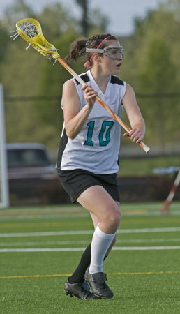 Lacrosse player passing the ballの写真素材