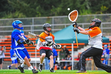April 11, 2011 OHSLA (Oregon High School Lacrosse Association) Salem Oregon Sprauge HS Junior Varsity V Churchill Oregon HS Junior Varsity.  Sprauge Olympians Goalie #39 blocks a shot from Churchill Lancers.  Final score 6-3 Churchill.のeditorial素材