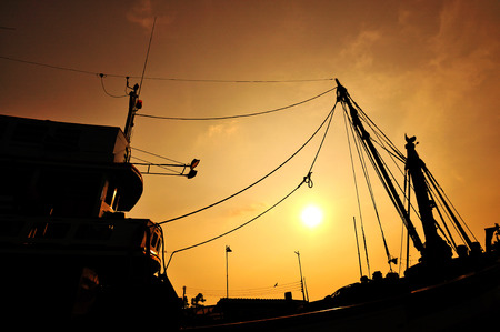 silhouette of fishing boatの写真素材