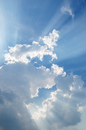 clouds in blue sky with sunraysの写真素材