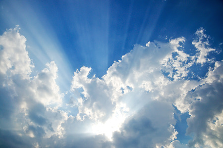 clouds in blue sky with sunraysの写真素材