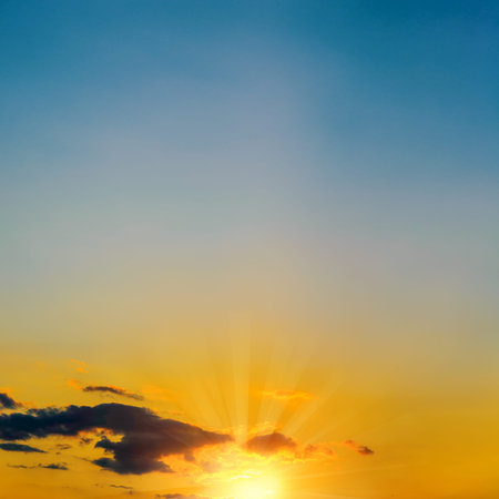 dramatic Sunset with sun rays through clouds
