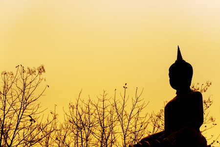 Buddha statue silhouette in sunshineの写真素材