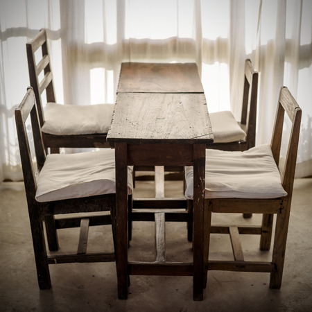 White room with wooden table and chair , Vintage styleの写真素材