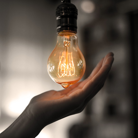 light bulb hold in handの写真素材