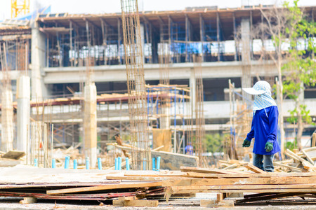Construction workers are bearing wood, to be unityの写真素材