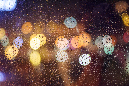 city lights abstract circular bokeh on blue backgroundの写真素材