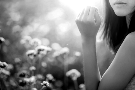 woman in the flower fields under evening sun light , black and whiteの写真素材