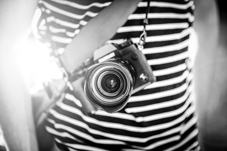 photographer holding retro camera