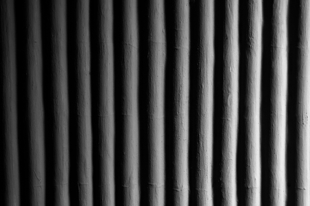 Old Concrete black stone wall backgroundの写真素材