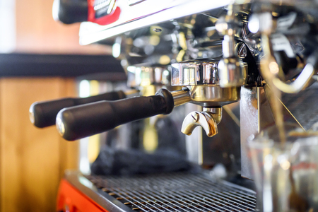 Close up professional coffee machine making espresso in a cafeの写真素材
