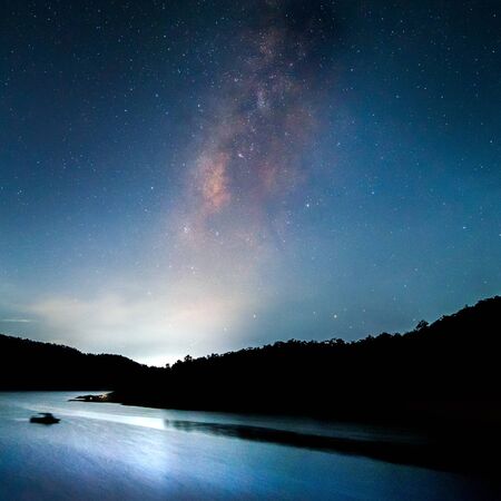 Beautiful landscape mountains and lake in the night with Milky Way background, Chiang mai , Thailandの写真素材
