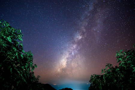 Beautiful landscape of  top mountains in  winter starry night sky with Milky Way background, Chiang...