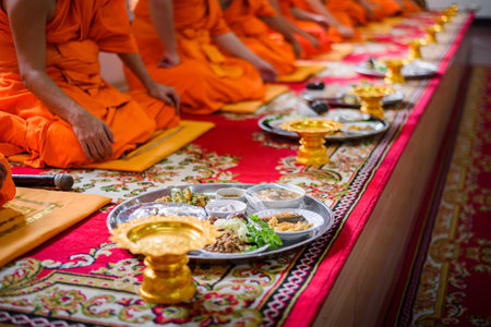 Thai cultural engagement ceremony monks having a lunch in a buddhist templeの写真素材