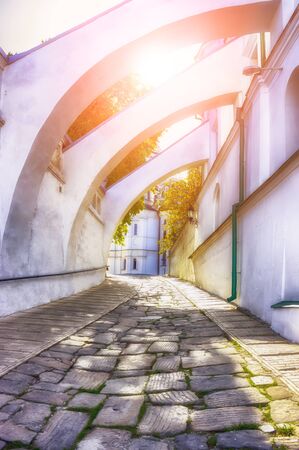 The sun shines through the buttress in the Pechersk Lavra. Kiev. Ukraineの写真素材