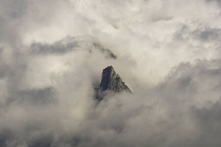 A single peak among the clouds. Mont Blanc massif. Alps.の写真素材