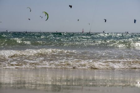 Marine wave with serfers in the background.の写真素材