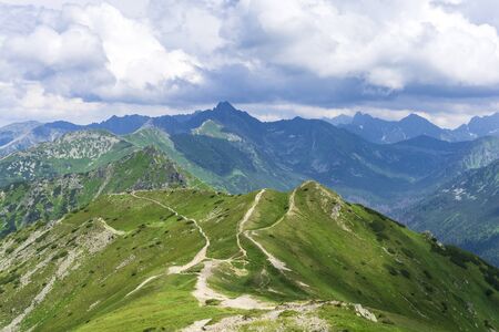 Peaks of the Tatras under the clouds in June.の写真素材
