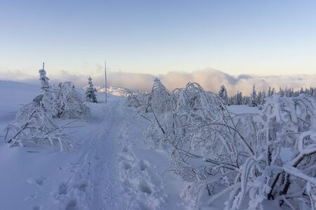 Clouds in the setting sunlight on mountain hills. Tatry.の写真素材