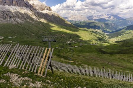 Green meadows surrounded by the Dolomites. Italy.の写真素材