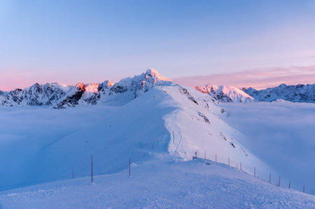 Big mountain peaks at sunset and inversion.