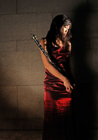 Mystery Woman With Her Musical Instrument In Underground Tunnelの写真素材