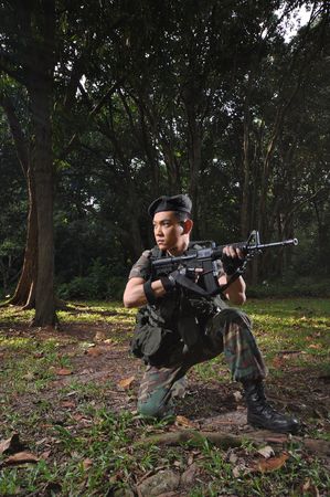 Smart Asian Soldier In The Forest の写真素材