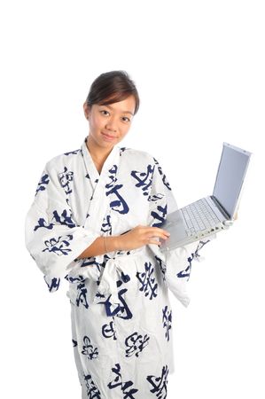 Beautiful Asian Woman In Kimono With Laptopの写真素材