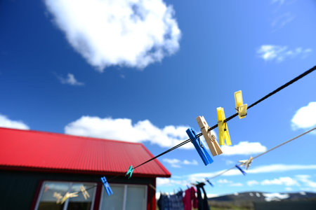 cheerful colors of clothes peg in the sun