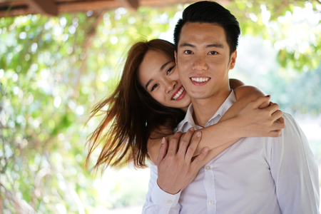 Asian couple in a close intimate relationshipの写真素材