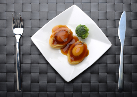 Top view of Abalone  servings in a fine dinning settingの写真素材