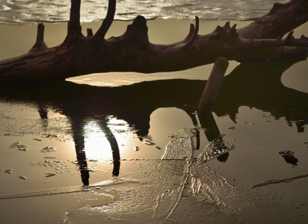 The winter lake in Caucasus sunny reflectionの写真素材