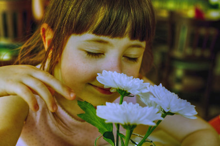 Agata smelling flowersの写真素材