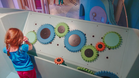 Girl playing and learning mechanicsの写真素材