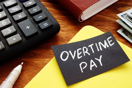 Text sign showing hand written words Overtime payの写真素材