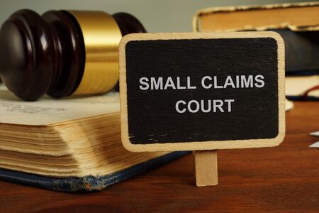 Text sign showing hand written words small claims courtの写真素材