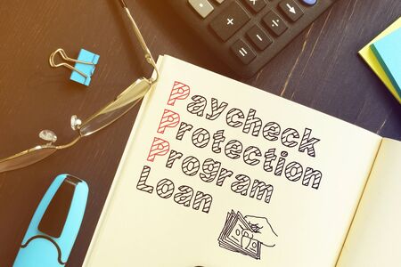Paycheck Protection Program PPP Loan is shown on the business photoの写真素材