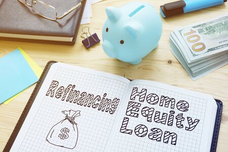 Refinancing vs. Home Equity Loan is shown on the conceptual photoの写真素材