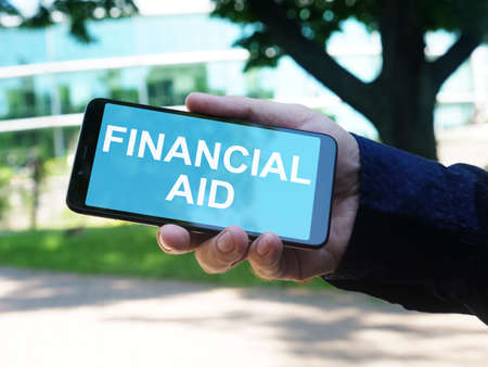 Financial aid is shown on the conceptual business photoの写真素材