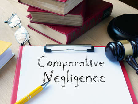 Comparative Negligence is shown on the conceptual photo using the textの写真素材