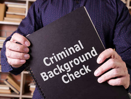Criminal background check is shown on a photo using the textの写真素材