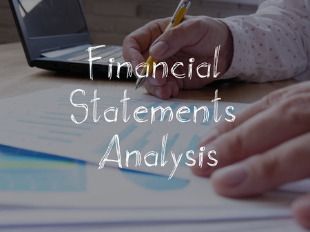 Financial statements analysis is shown on the business photo using the text