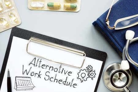 Alternative Work Schedule is shown on the business photo using the textの写真素材